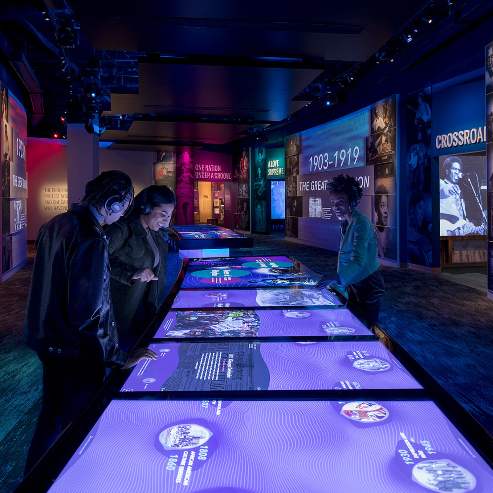 Visitors use interactive media table to learn more about African American culture.